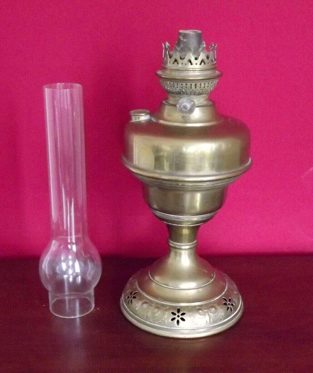 Vintage brass oil lantern with decorative base and transparent glass funnel stamped L B Brand Delay 4399.