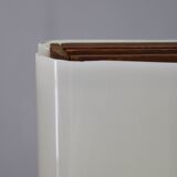 Mid-century modern floor lamp on iron legs with plastic shade and wood accent