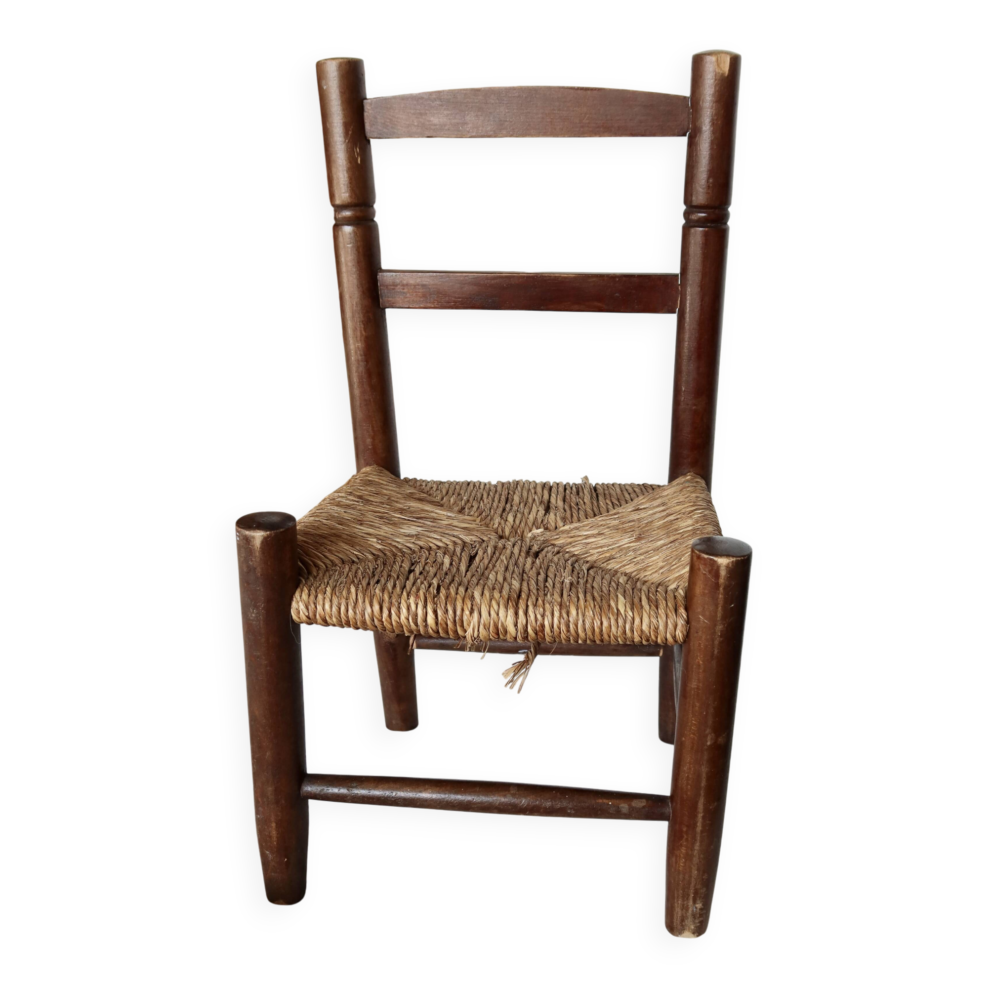 Vintage children's chair in dark wood with woven straw seat