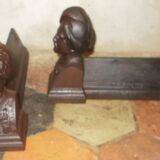 Old cast iron andirons with oriental decor