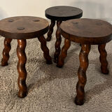 Wooden tripod stool with twisted legs
