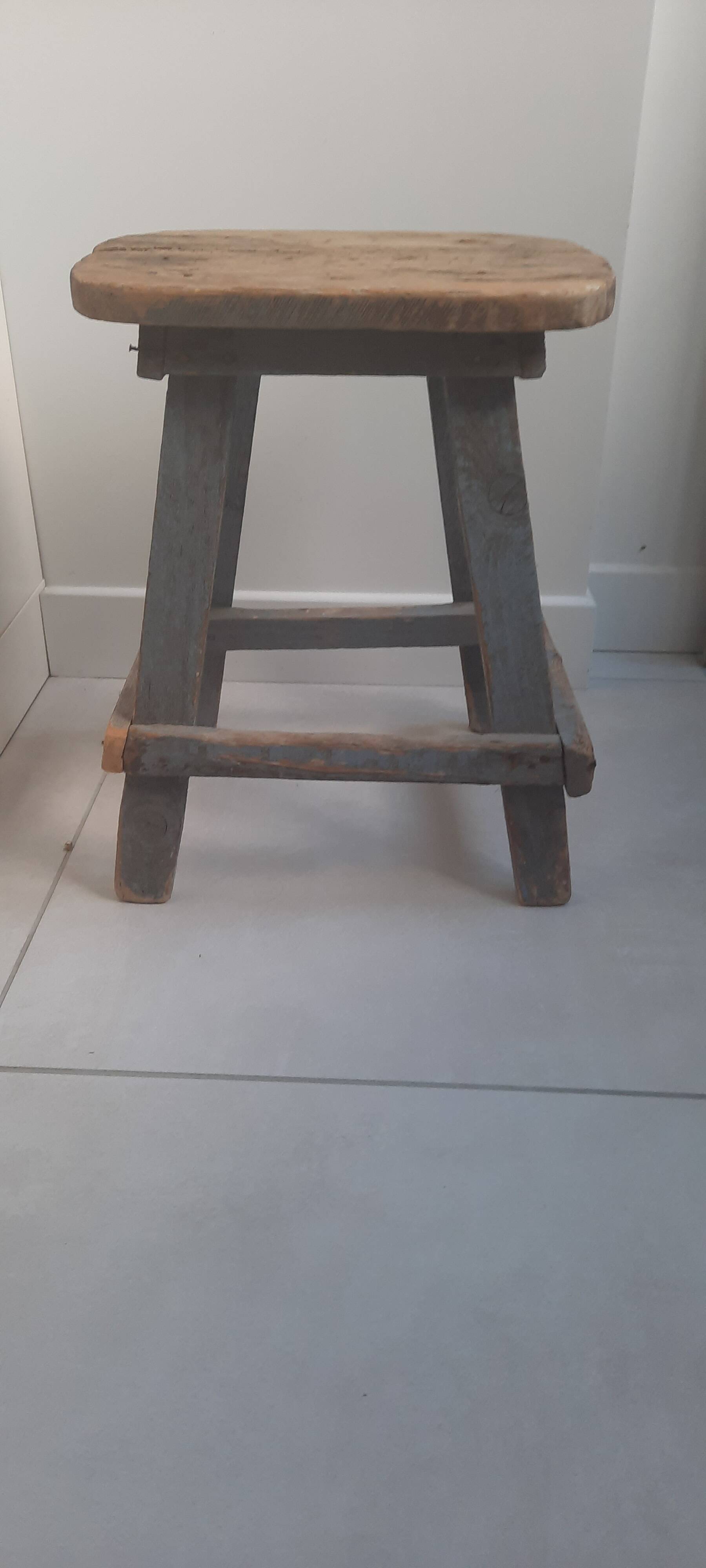 Antique wooden stool in the brutalist style