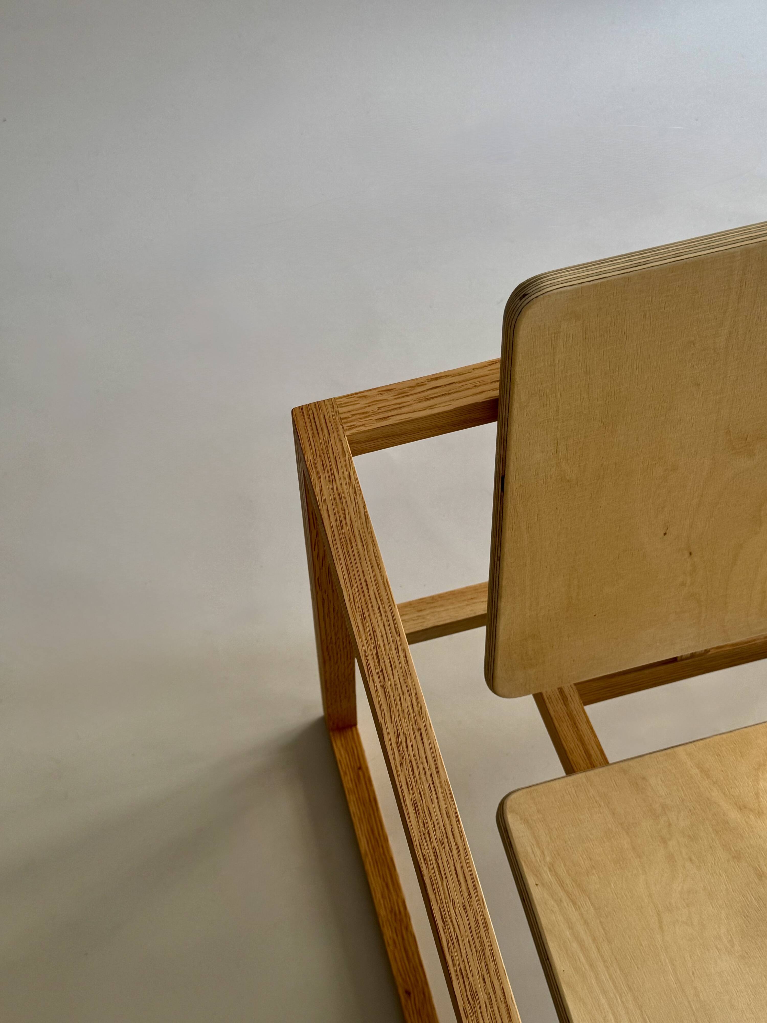 Pair of handmade wooden armchairs