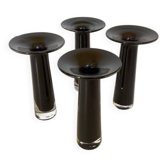 Four black glass paste candle holders