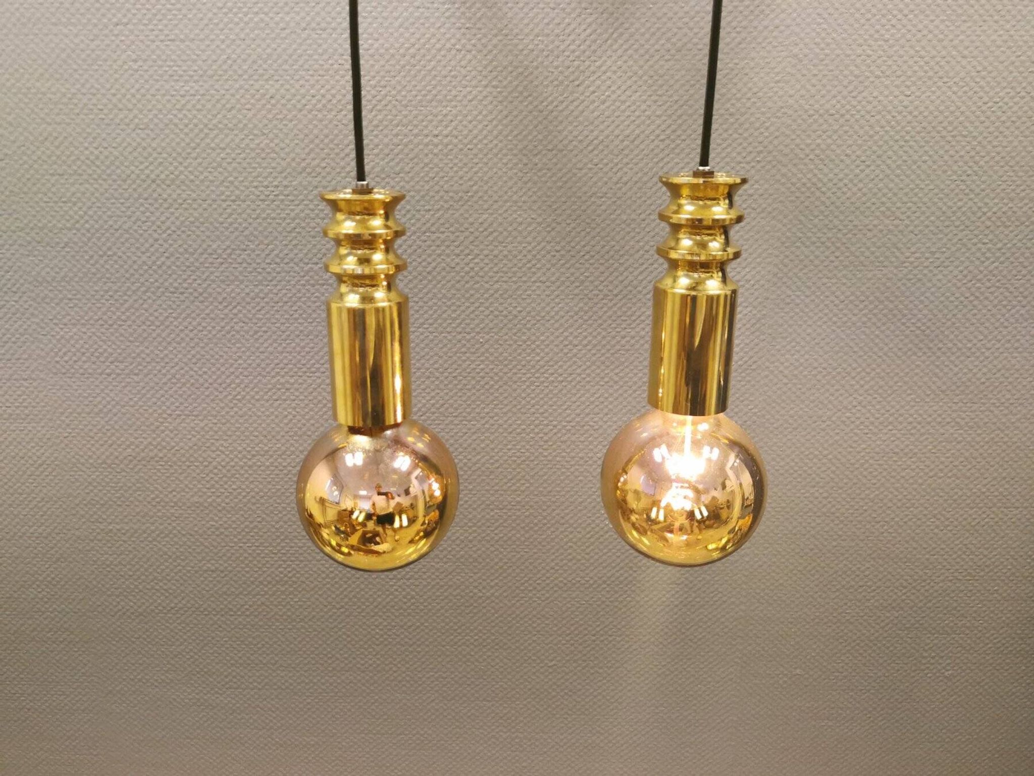 Frimann Goldstar pendant lights made by Philips in the 1970s. Model SPYBALL