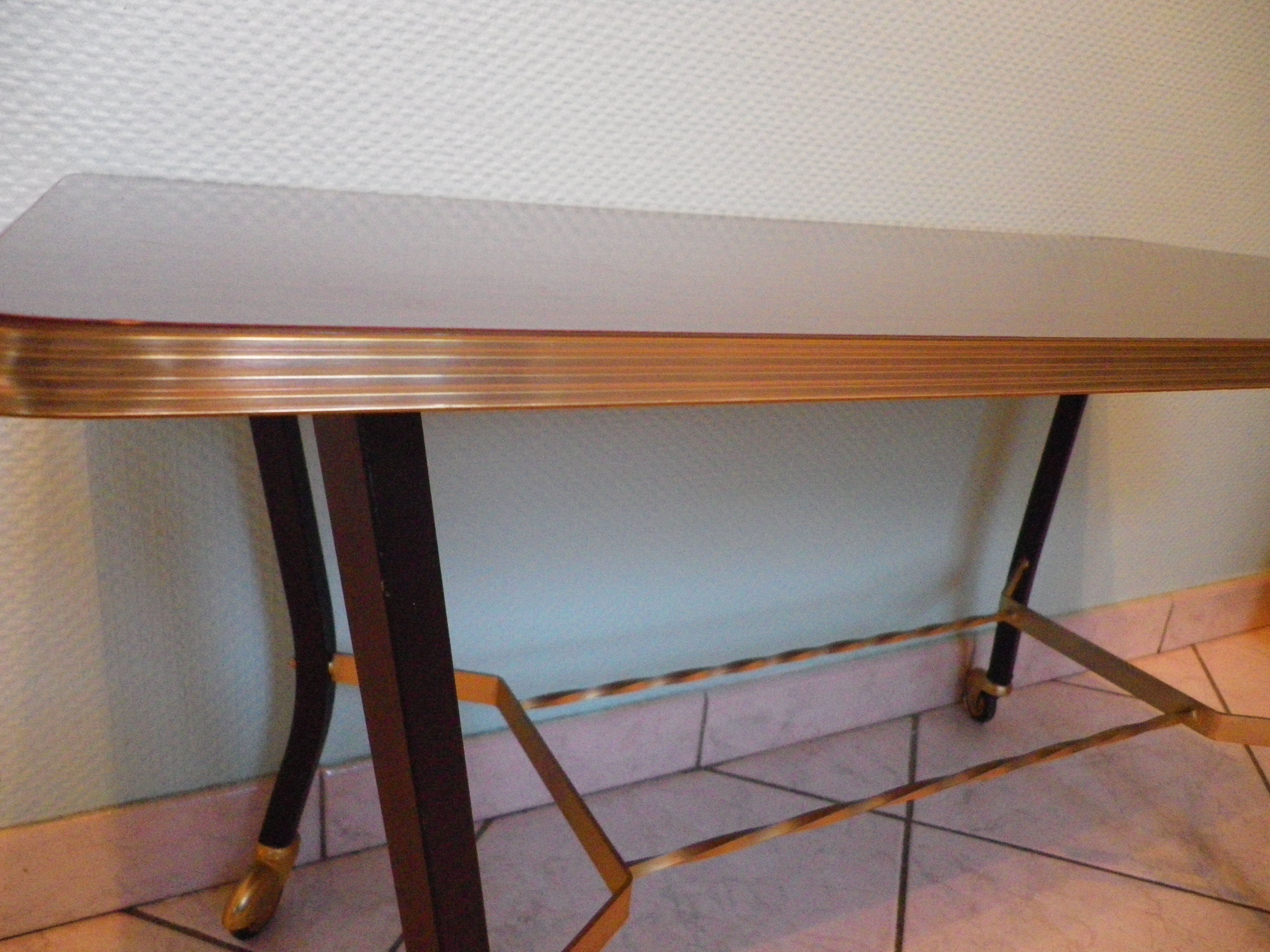 Lounge table, side table on wheels, formica top, gold and black metal