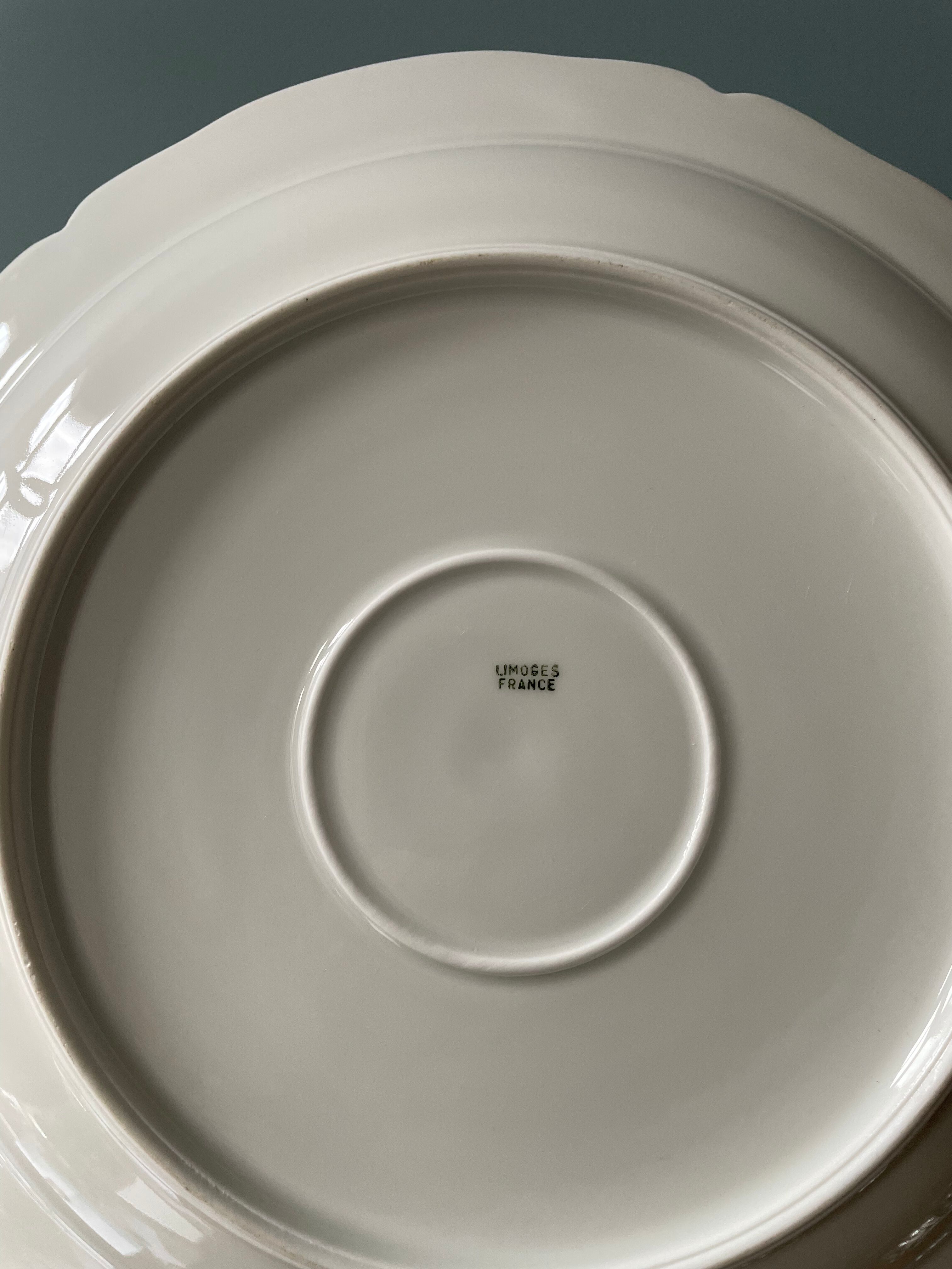 Old hollow round dish in Limoges porcelain