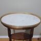 Saddle pedestal table with marble top in Louis XV style