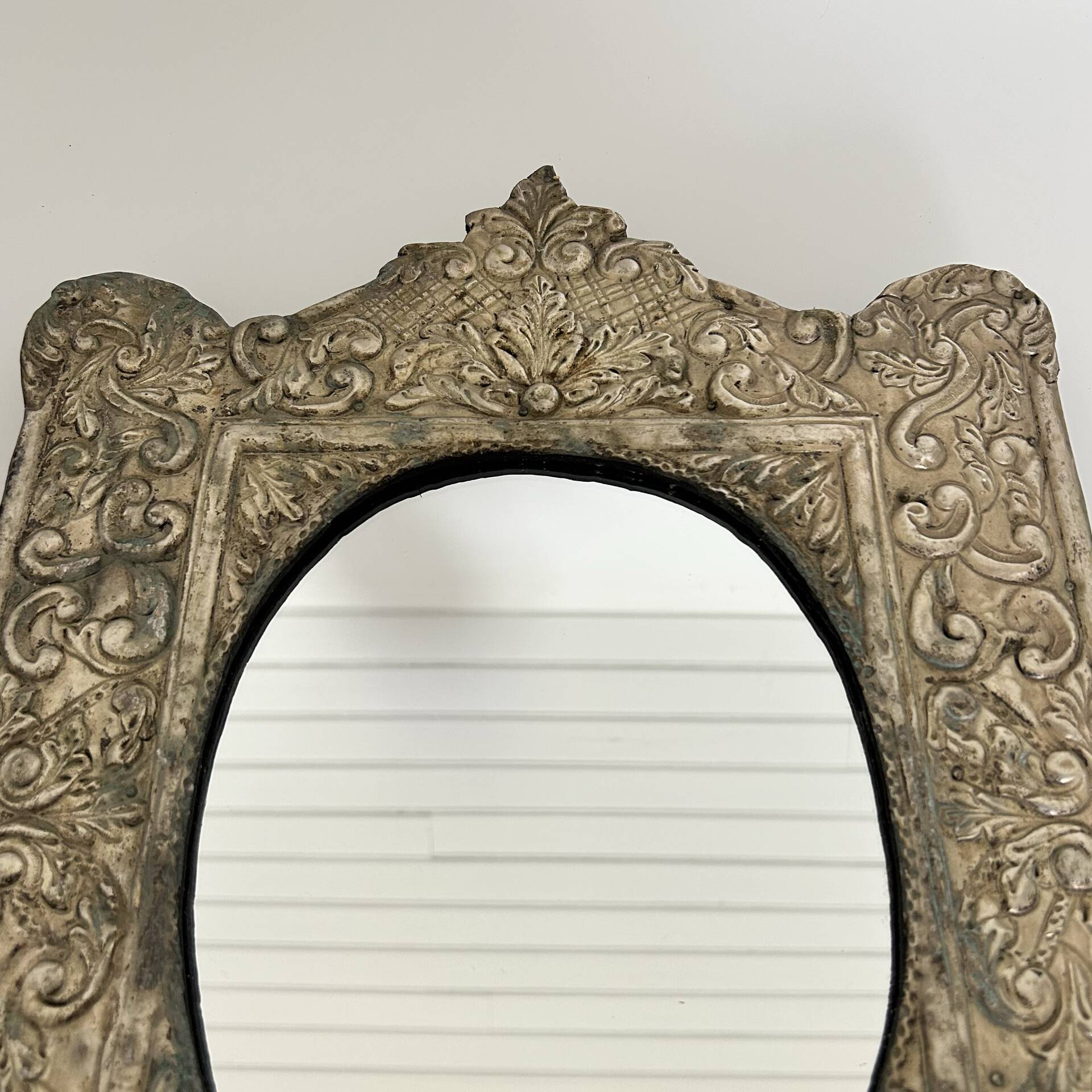 Baroque mirror in repoussé brass