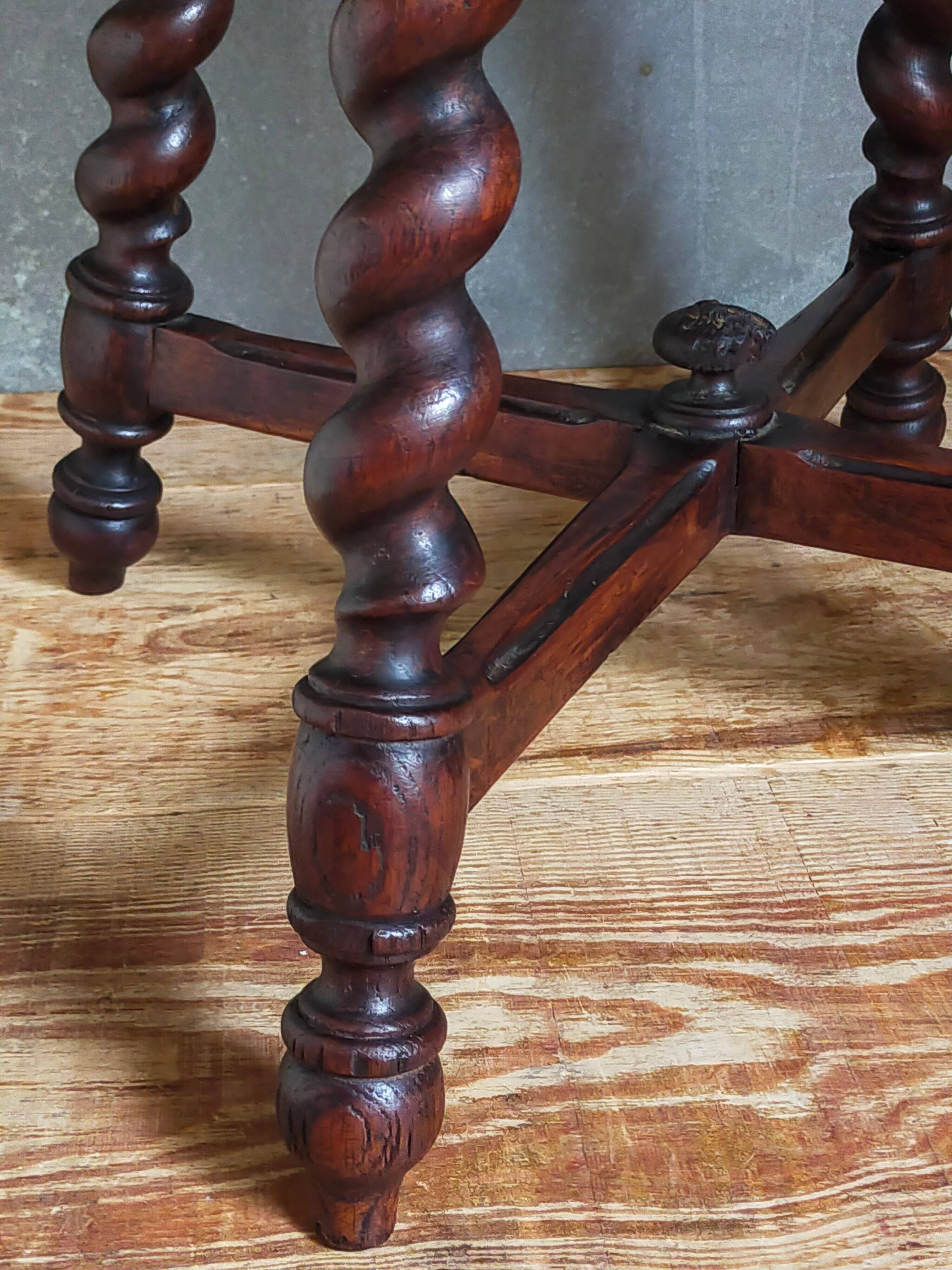 Antique stool in turned and carved solid wood