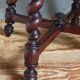 Antique stool in turned and carved solid wood