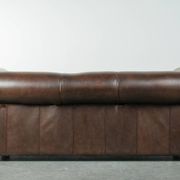 Set of a smooth chesterfield sofa and armchair with a timeless English look