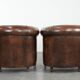 Set of two sheepskin club armchairs with fixed seat cushions