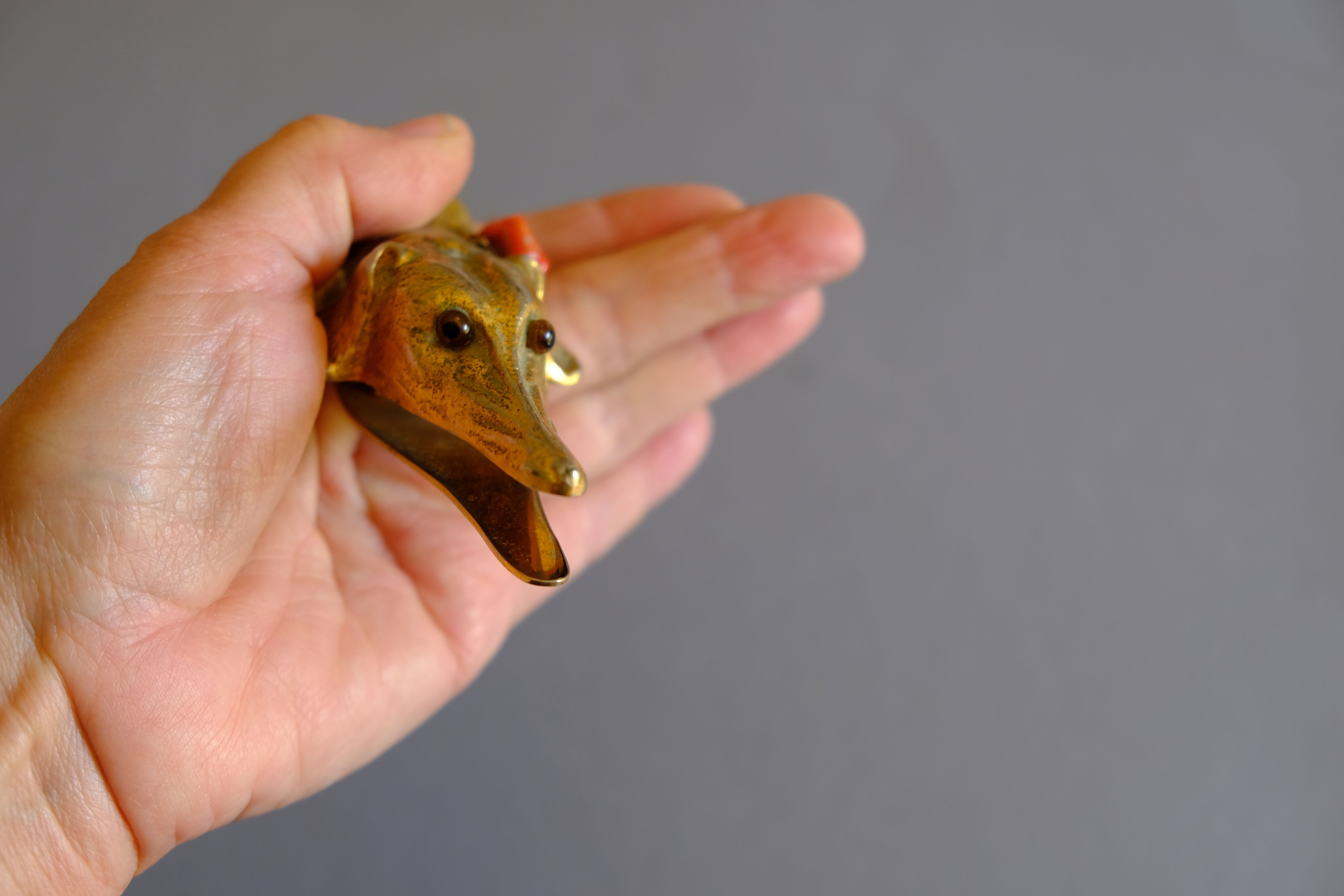 Ancient greyhound-headed mail clip, bronze