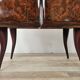 Mid-century mahogany bedside tables with mirrored tops.