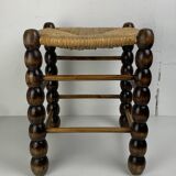 Brutalist wood turned bobbin rush stool in the style of Charles Dudouyt