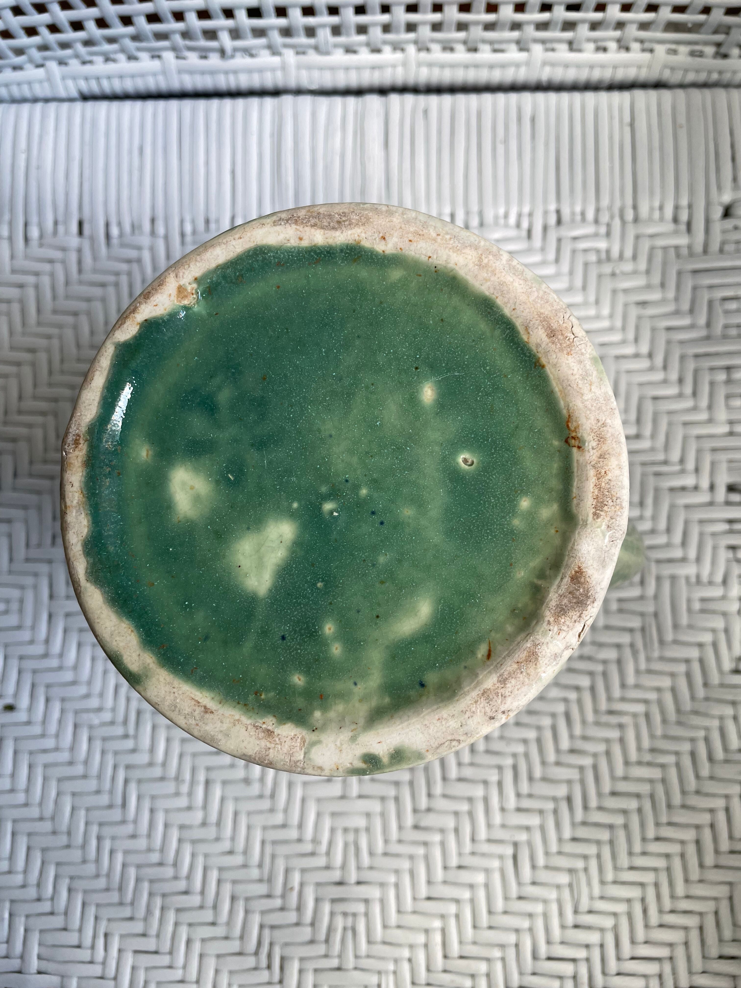 Turquoise green enamelled ceramic pitcher