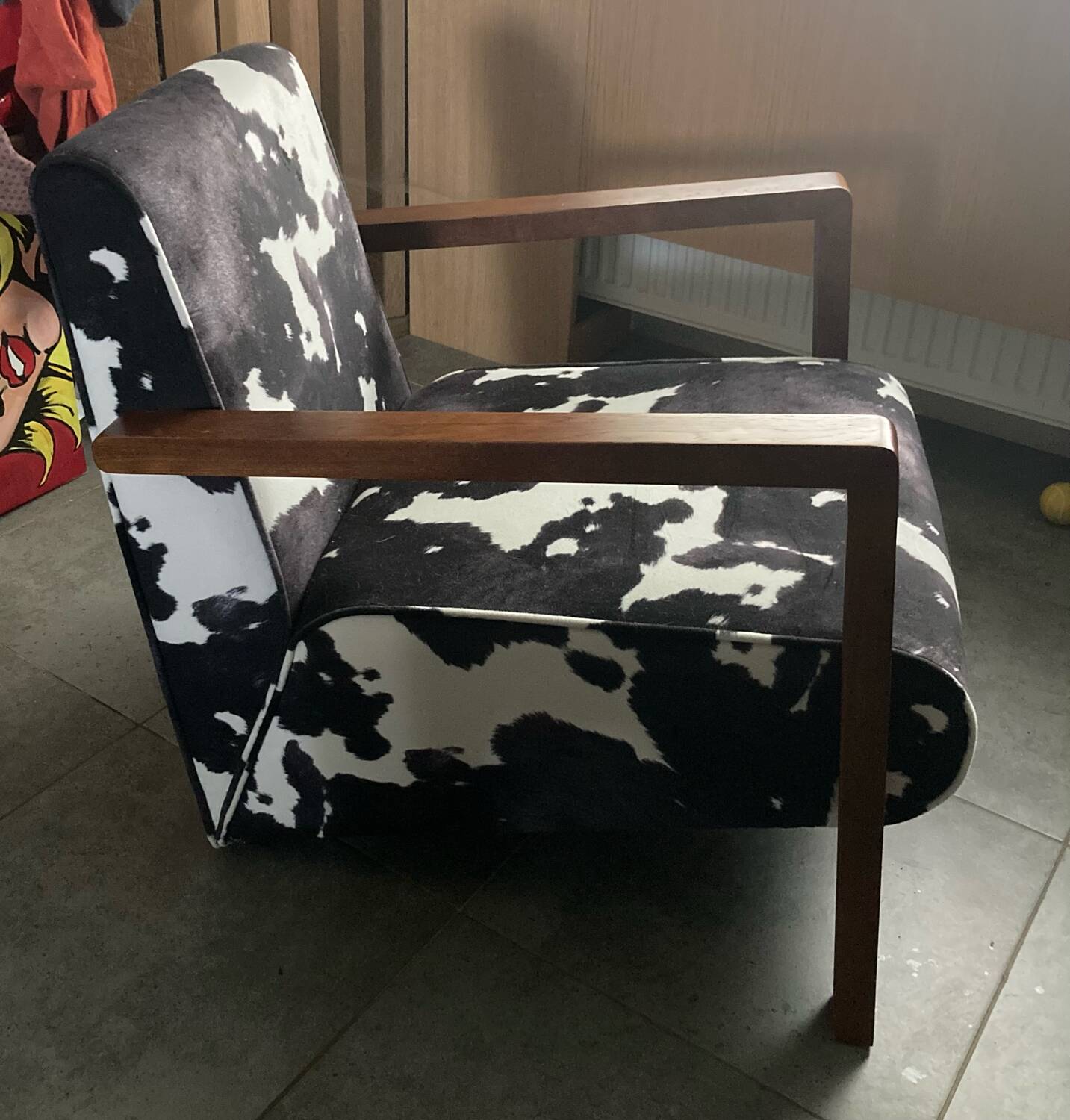 Armchair in walnut and animal print velvet