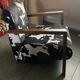 Armchair in walnut and animal print velvet