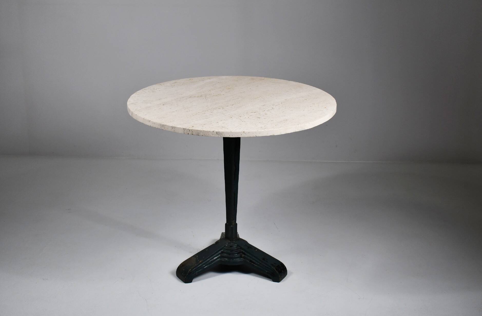 Vintage travertine bistro/dining table with metal base. (B)