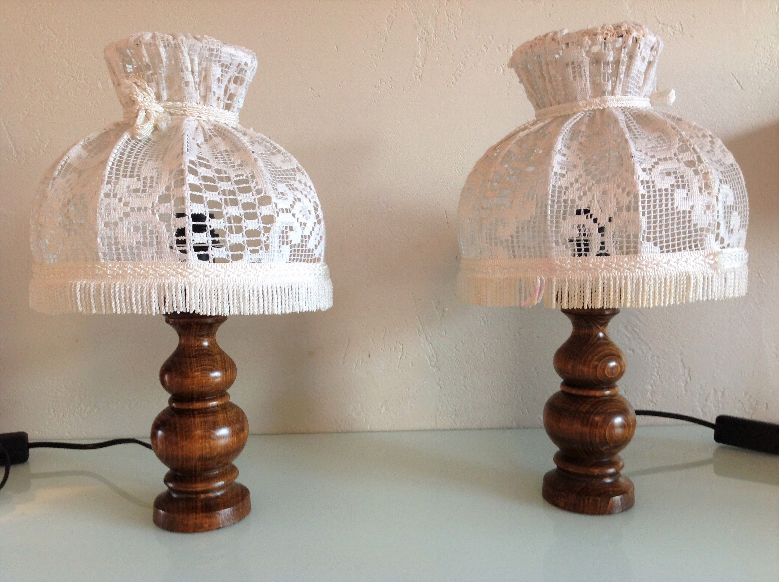 Pair of turned wooden bedside lamps and lace/vintage lampshade 60s-70s