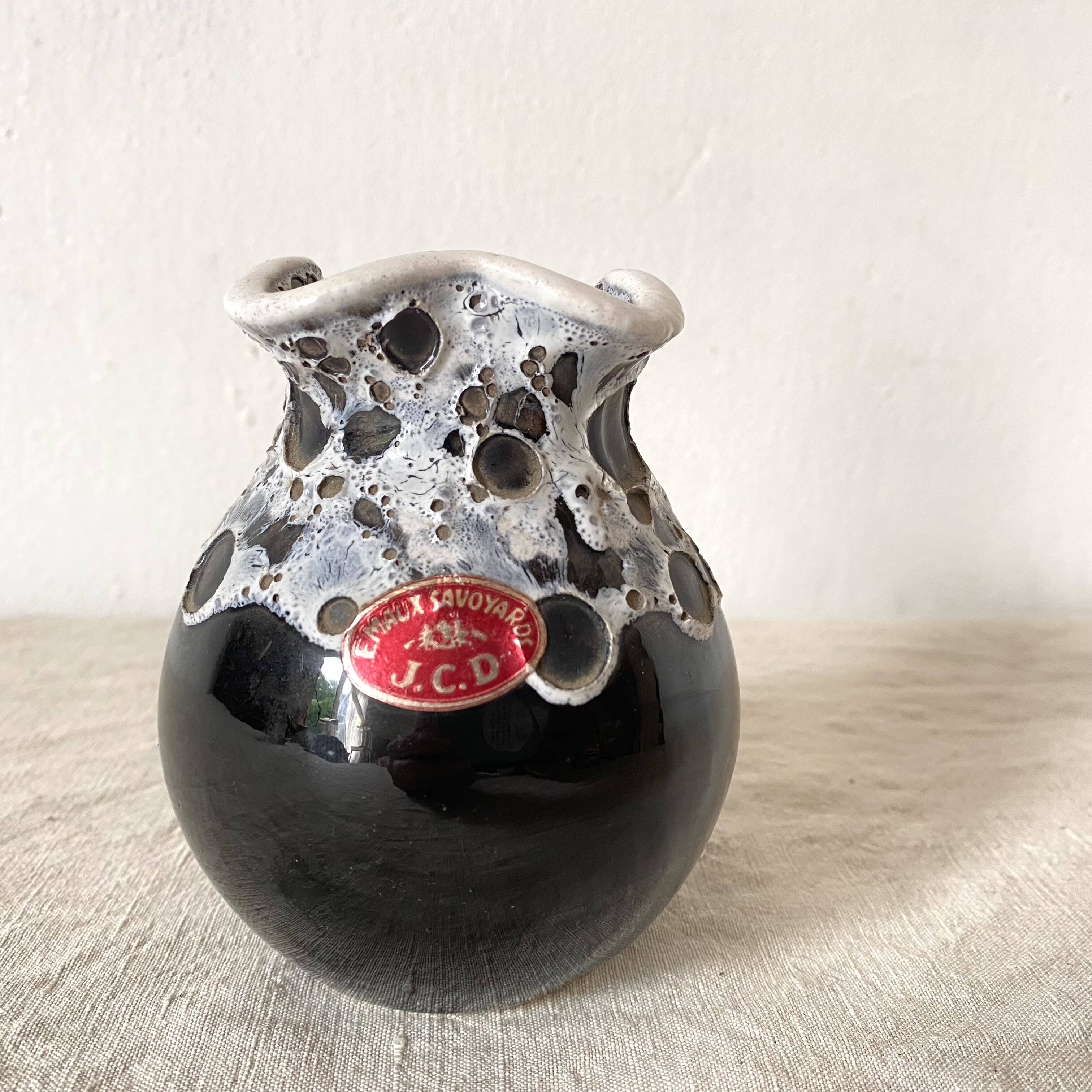 Vintage black and white Savoyard enamel vase