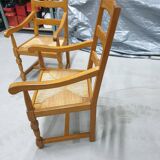 Two oak armchairs with straw seats