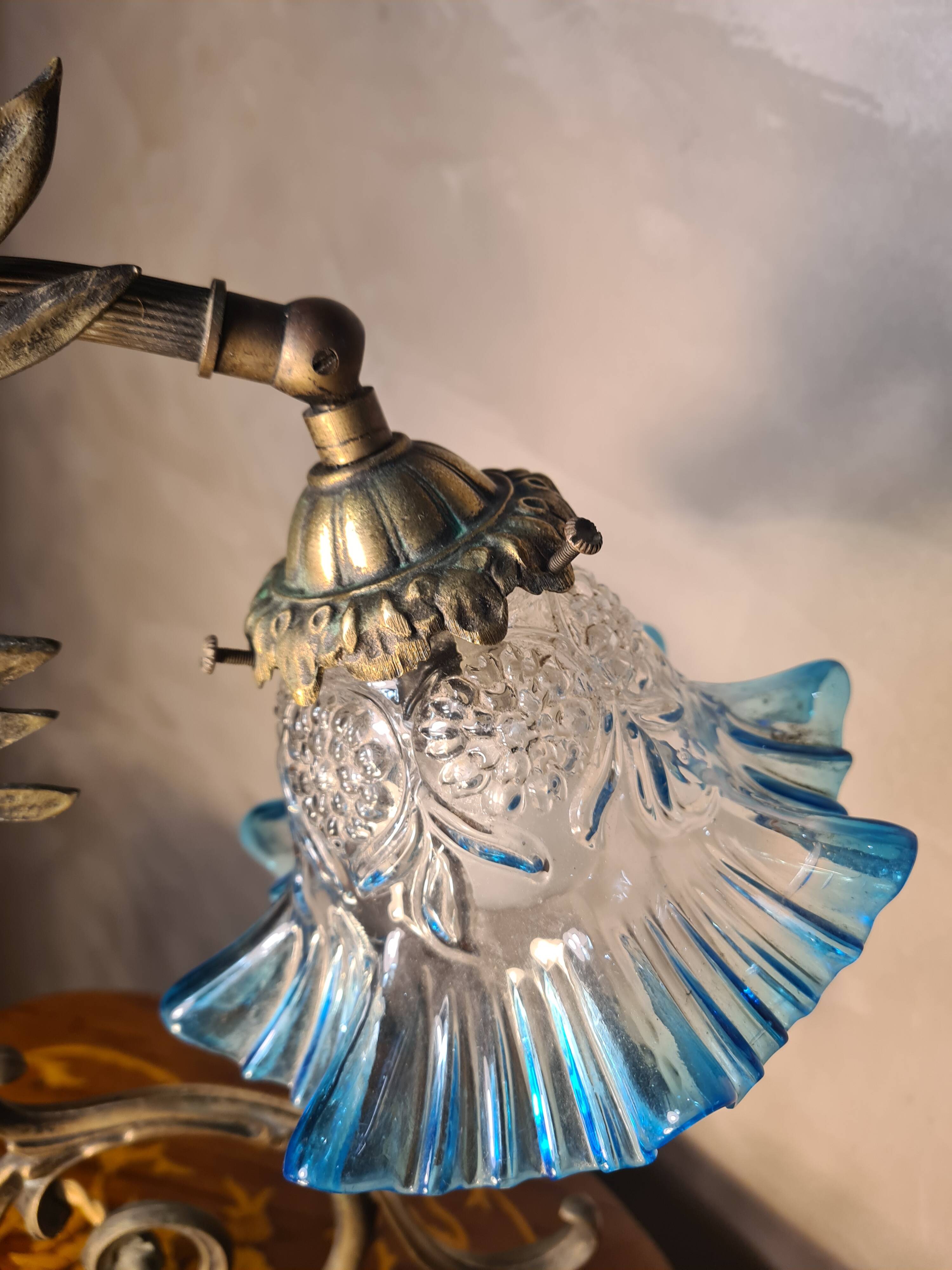 Bronze and brass lamp, transparent and blue glass shade.