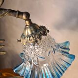 Bronze and brass lamp, transparent and blue glass shade.