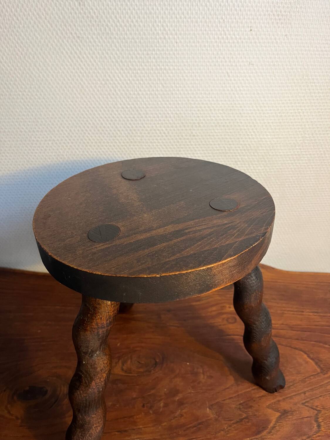 Round wooden tripod stool