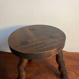 Round wooden tripod stool
