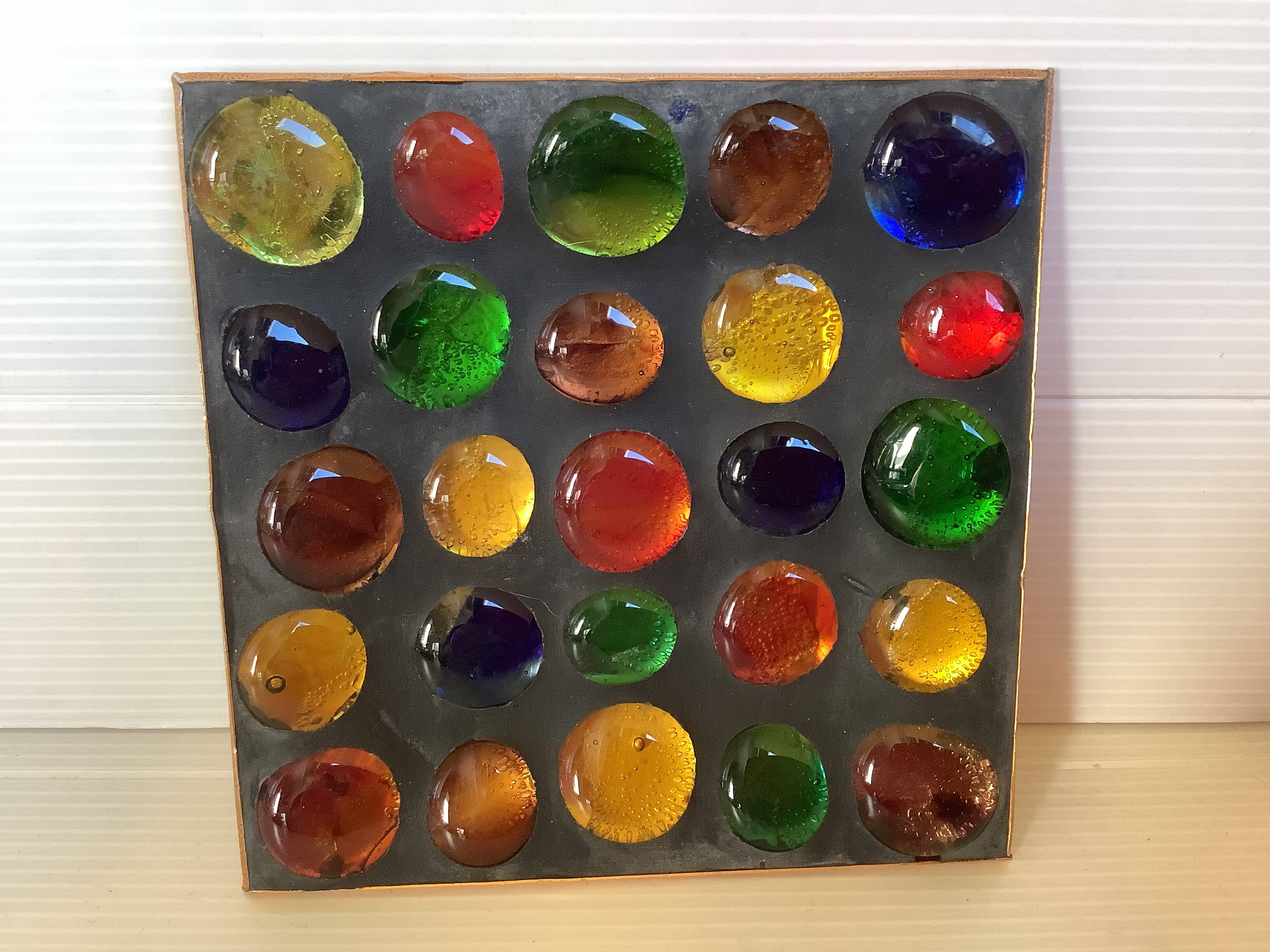 Empty pocket of multicolored glass pellets