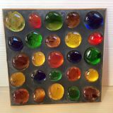 Empty pocket of multicolored glass pellets