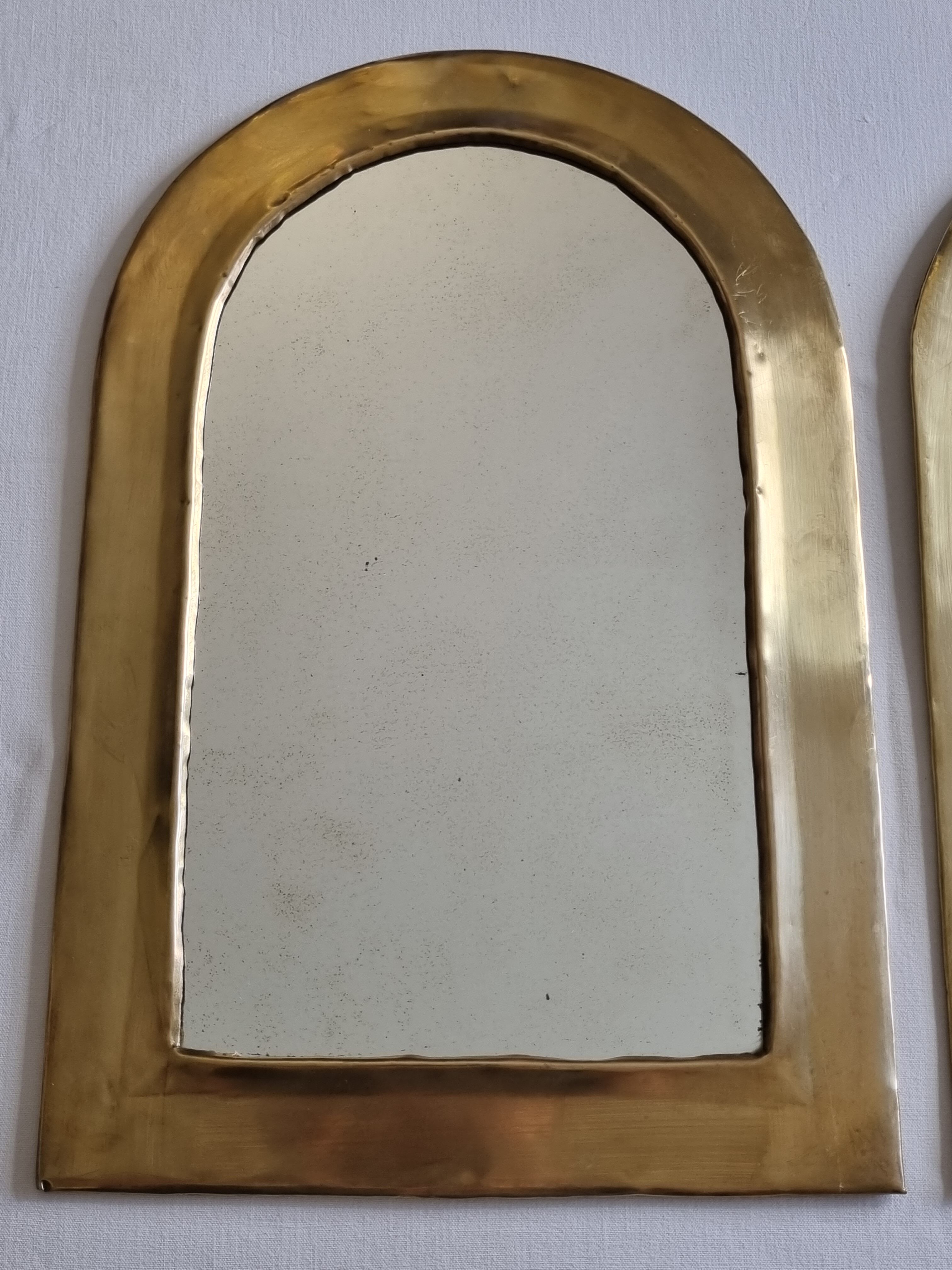 Set of three Moroccan brass mirrors in the form of arches, 43 cm