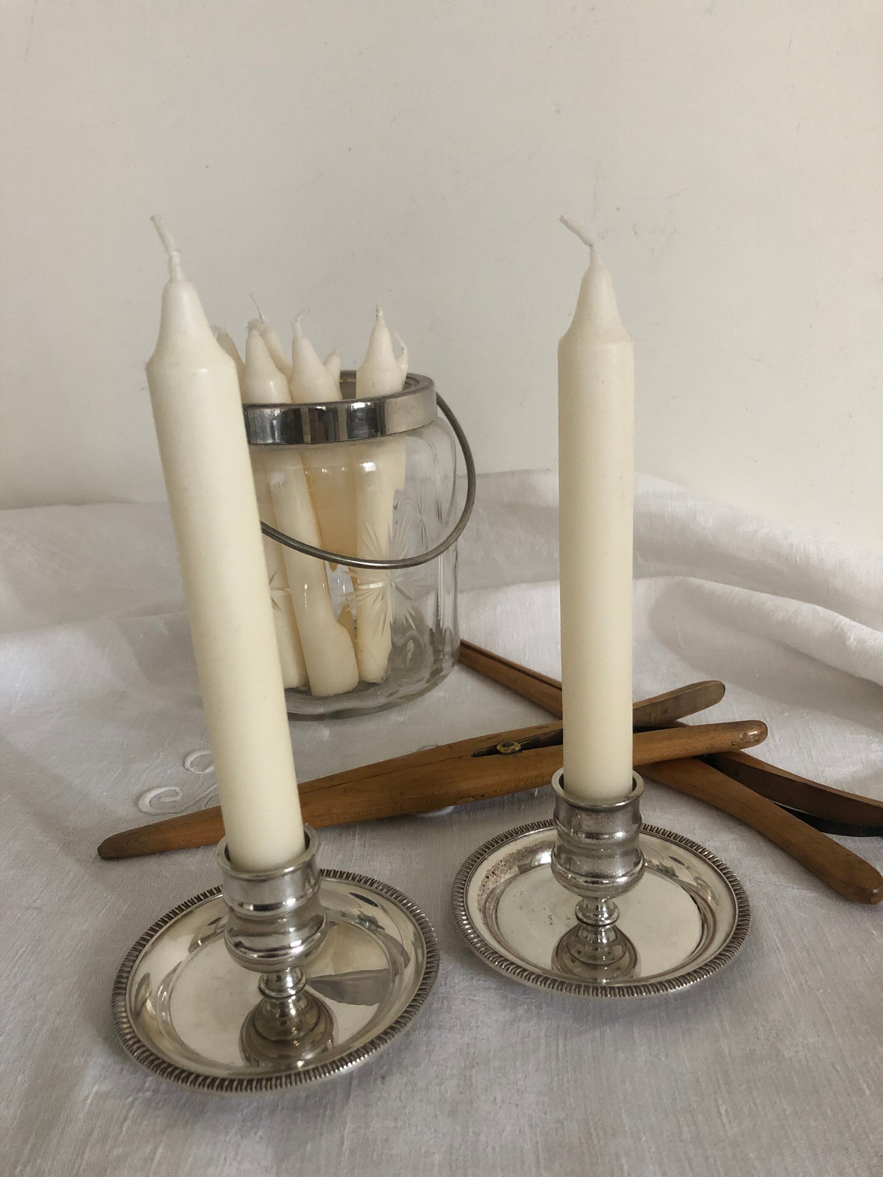 Two silver metal candlesticks