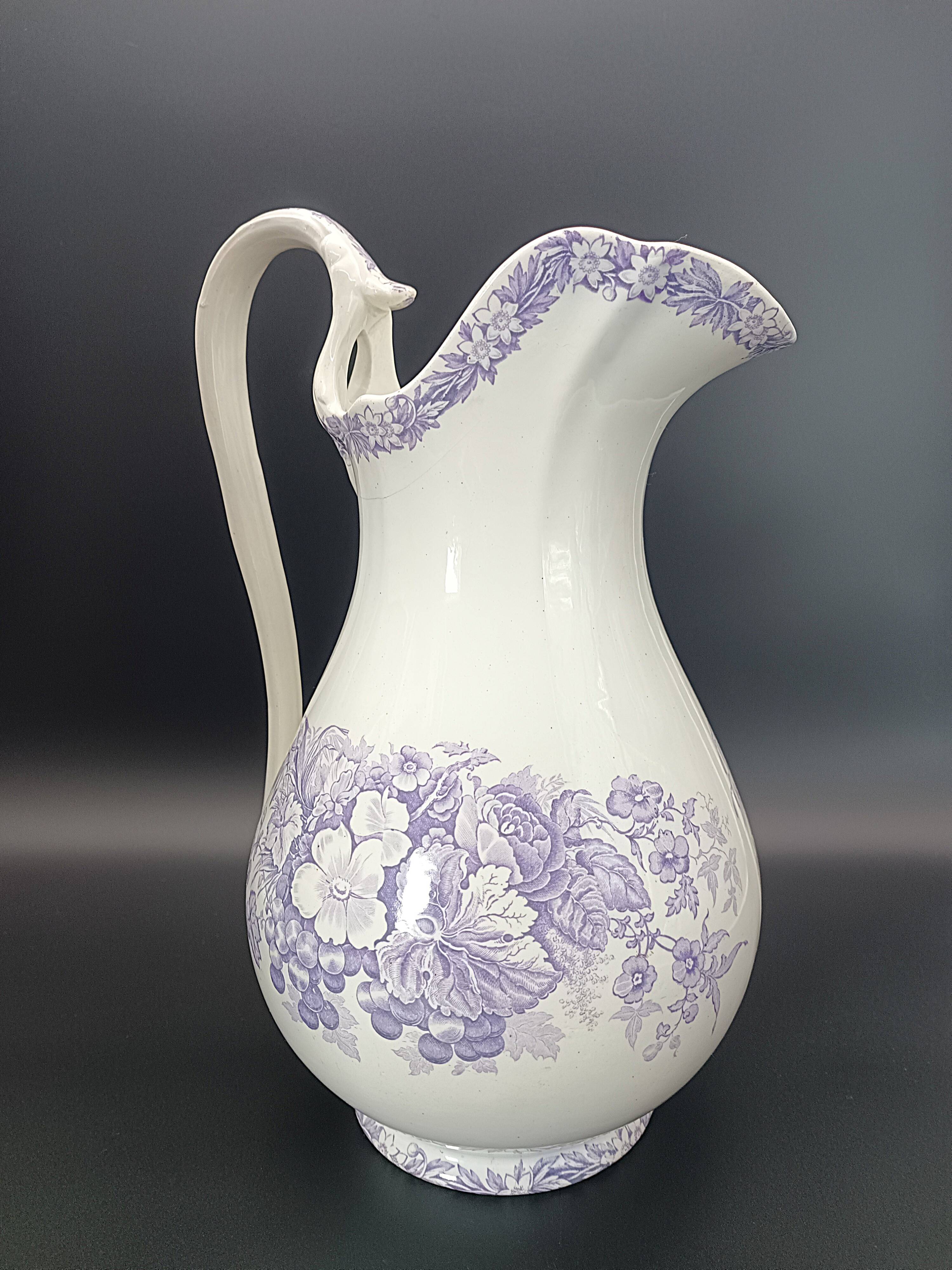 Large antique toilet bowl by Jules Vieillard Bordeaux with violet floral decoration.