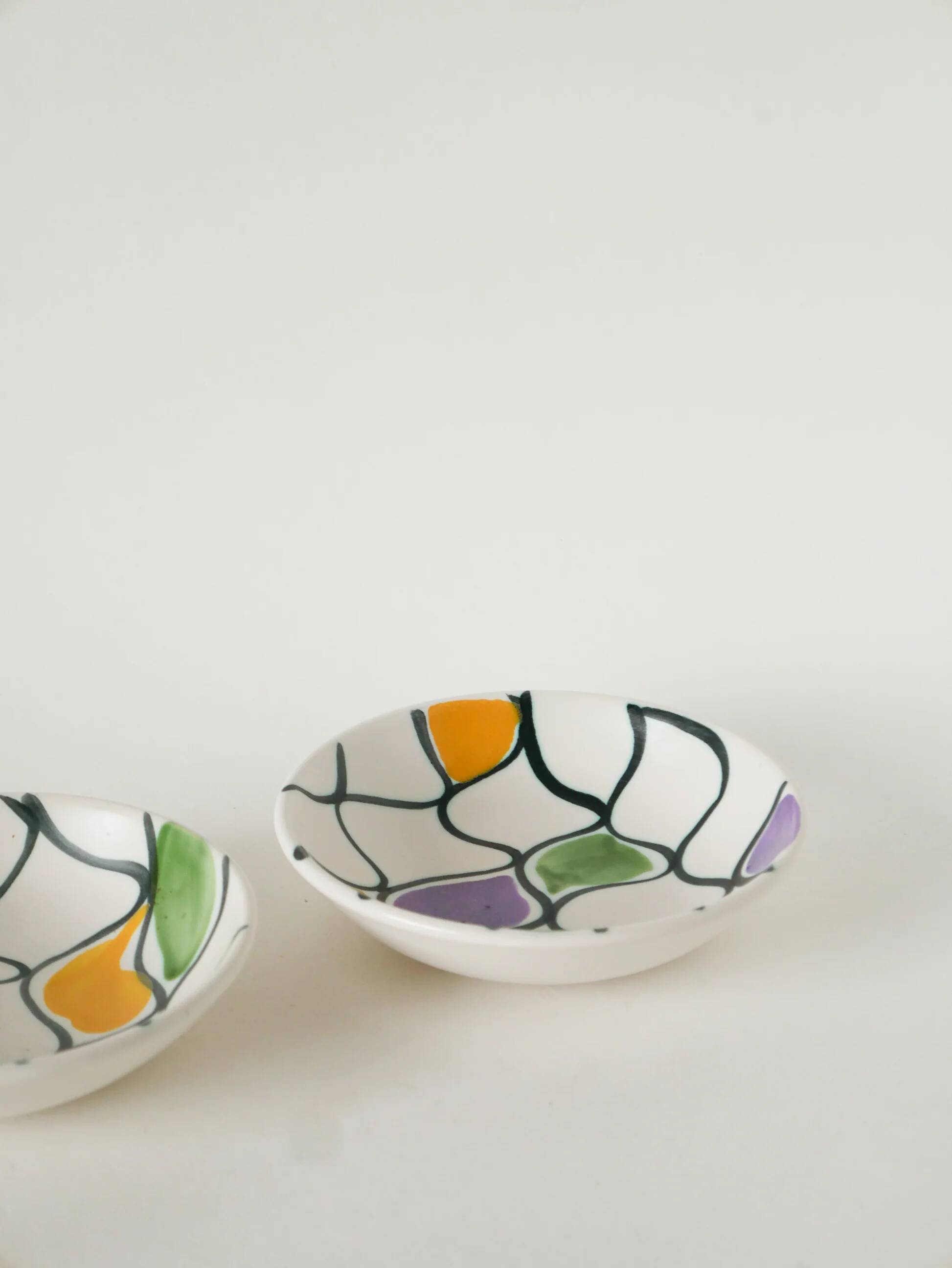 Pair of ceramic ramekins, abstract patterns in yellow, purple and green, Pornic model, 1960.