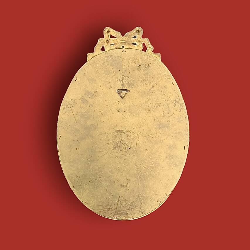 Antique oval mirror in gilded resin with Louis XVI style knot decoration
