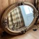 Oval gold mirror