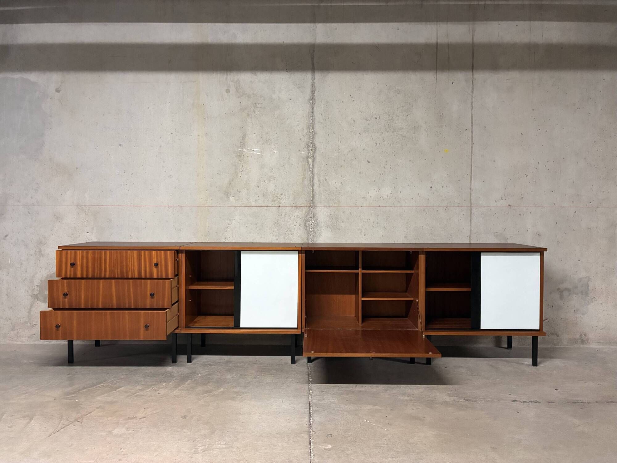 Enfilade buffet display cabinet in vintage 1950s style.