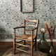 Fauteuil vintage en bois et assise paillée