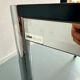 Large table design USM Haller with a white top and chrome structure.