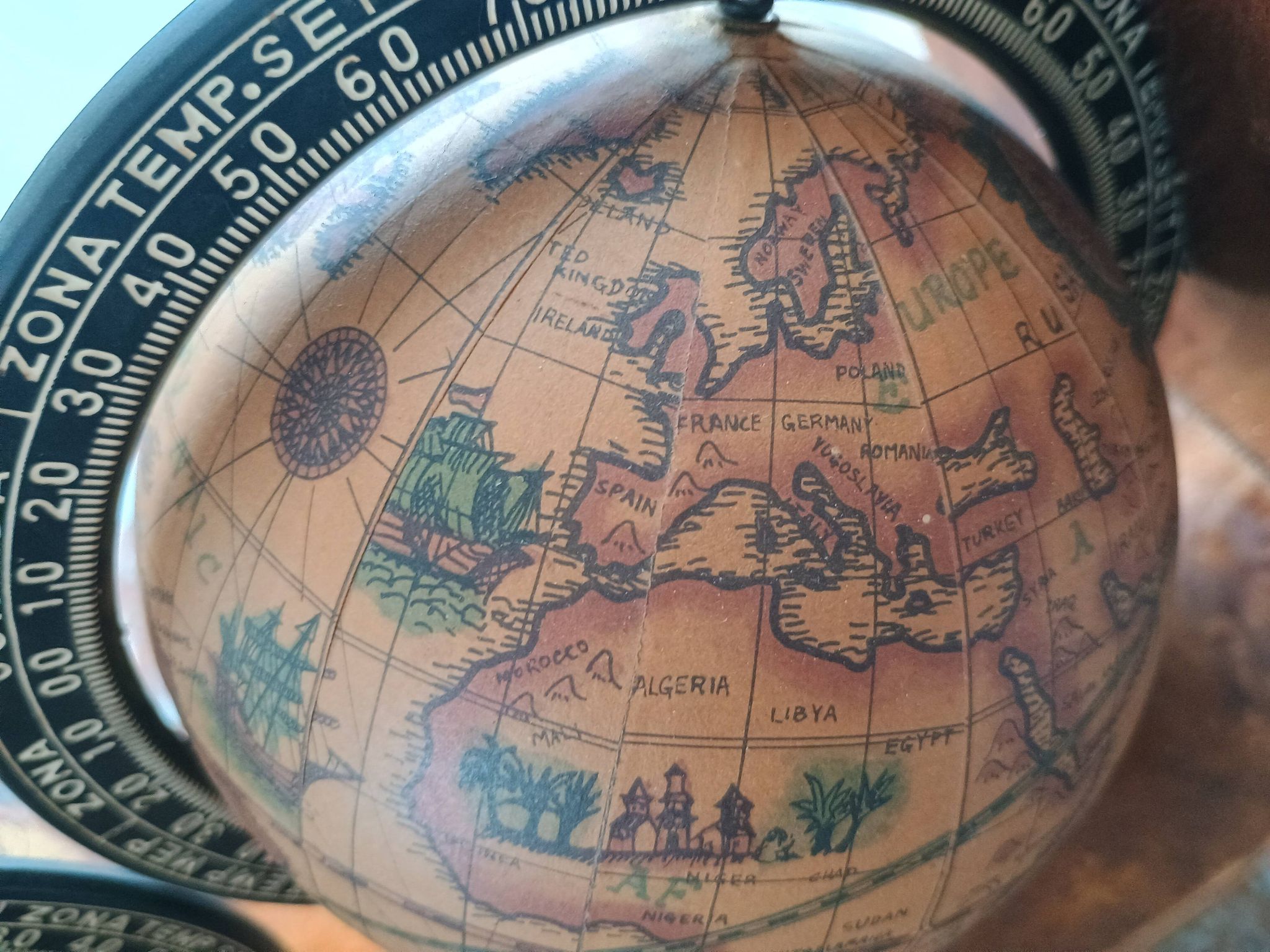 Pair of vintage bookends with rotating terrestrial globes on wooden bases in Spain