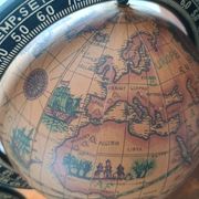 Pair of vintage bookends with rotating terrestrial globes on wooden bases in Spain