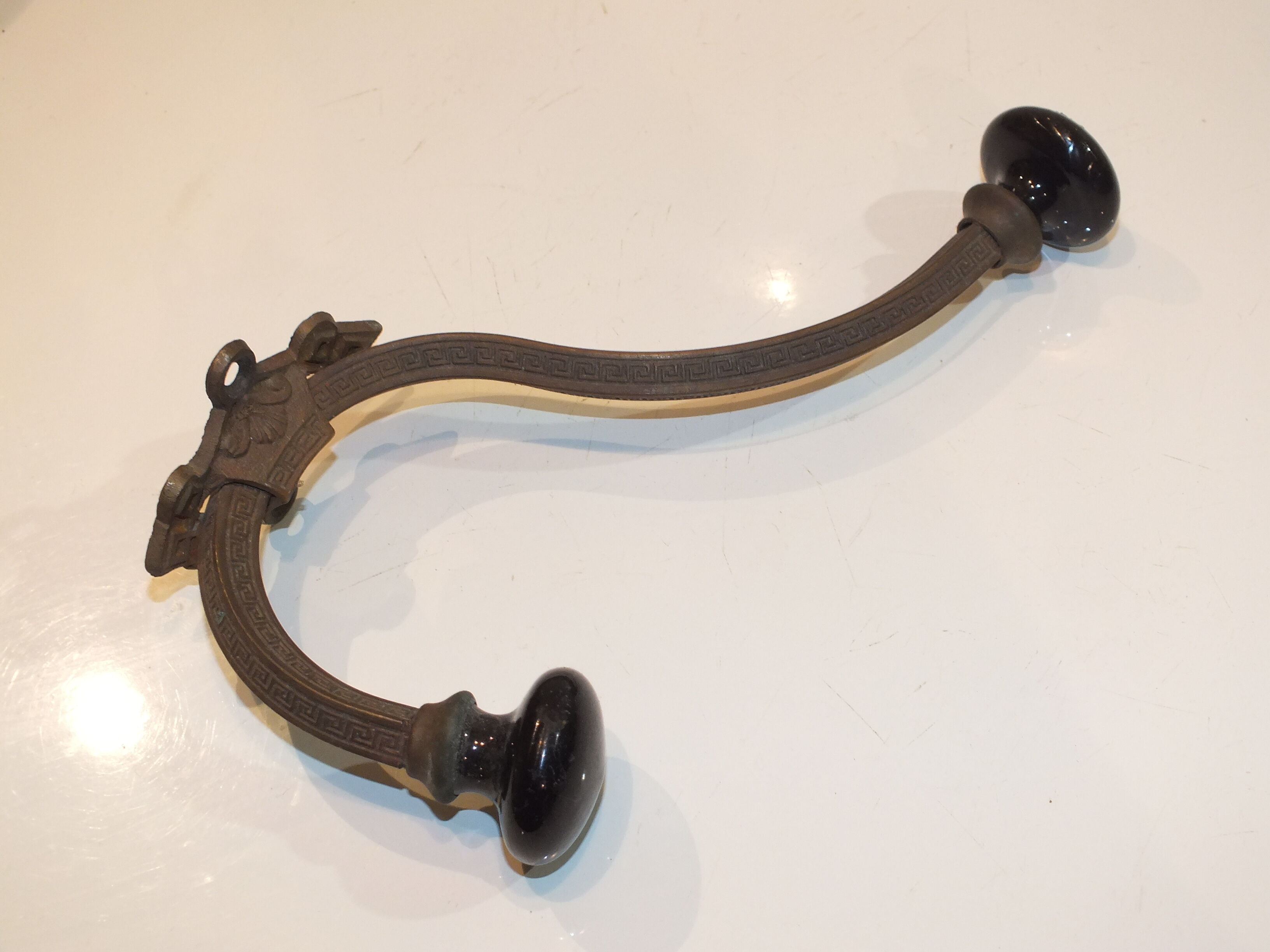 Old large hook Napoleon III in brass and earthenware