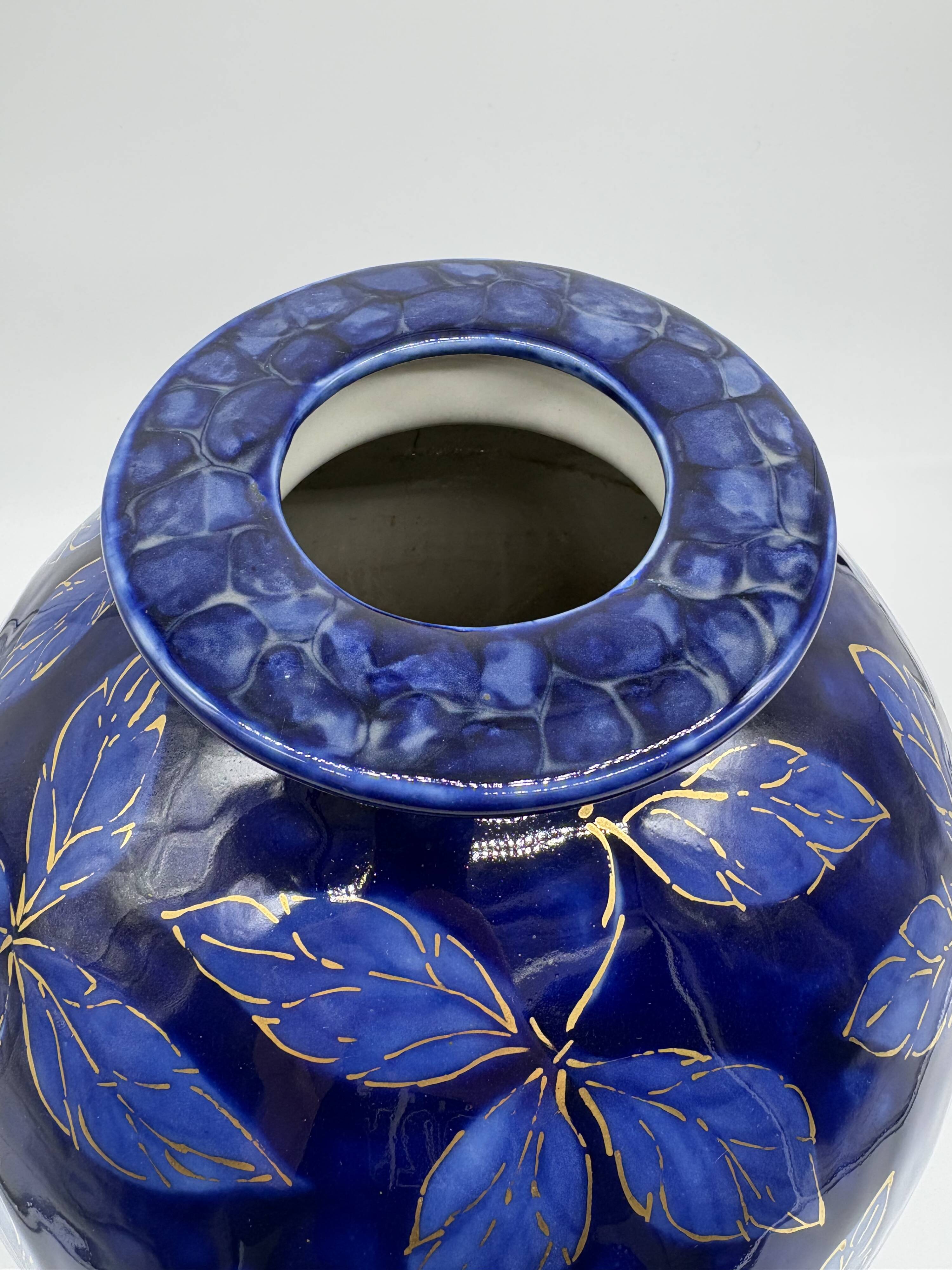 Large Tharaud Limoges vase in cobalt blue porcelain with floral decoration.