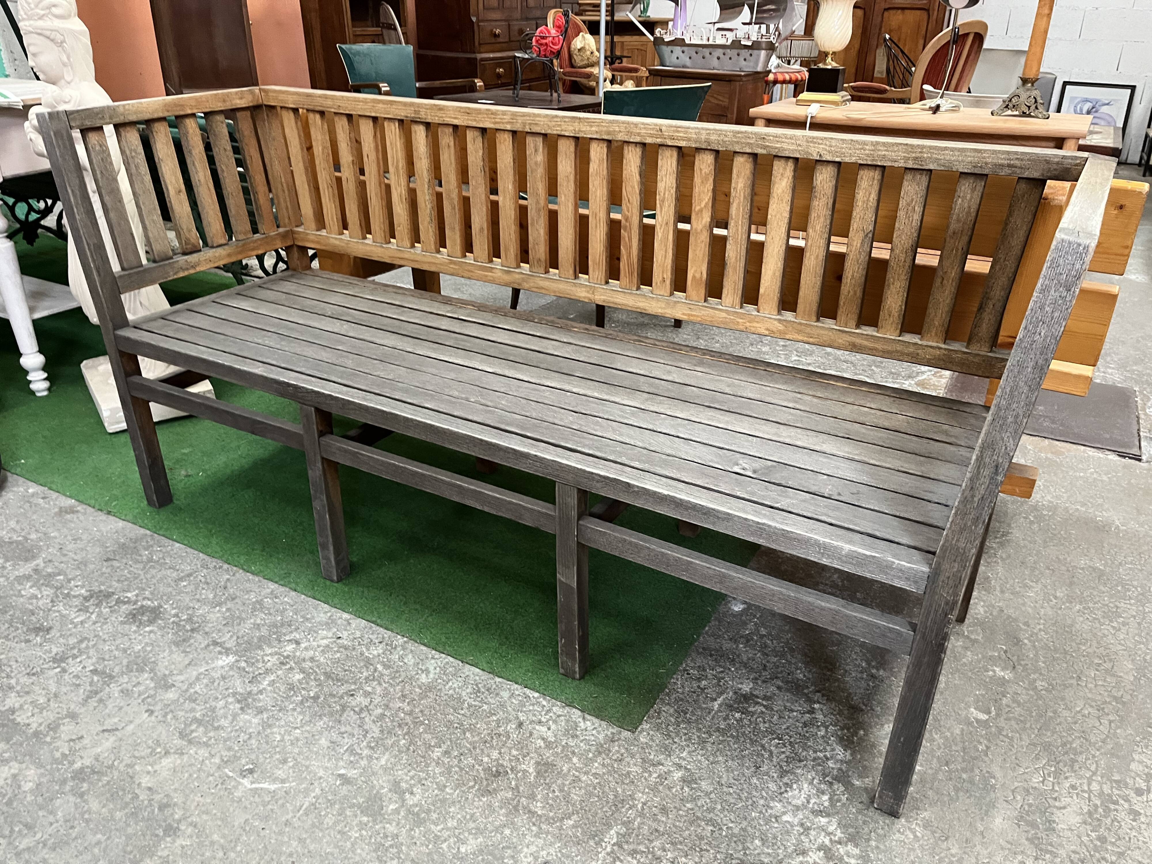 Colonial-style teak bench