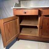 Antique wood and marble kitchen sideboard with carved backsplash