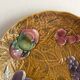 Large round Sarreguemines slip dish with fruit decoration