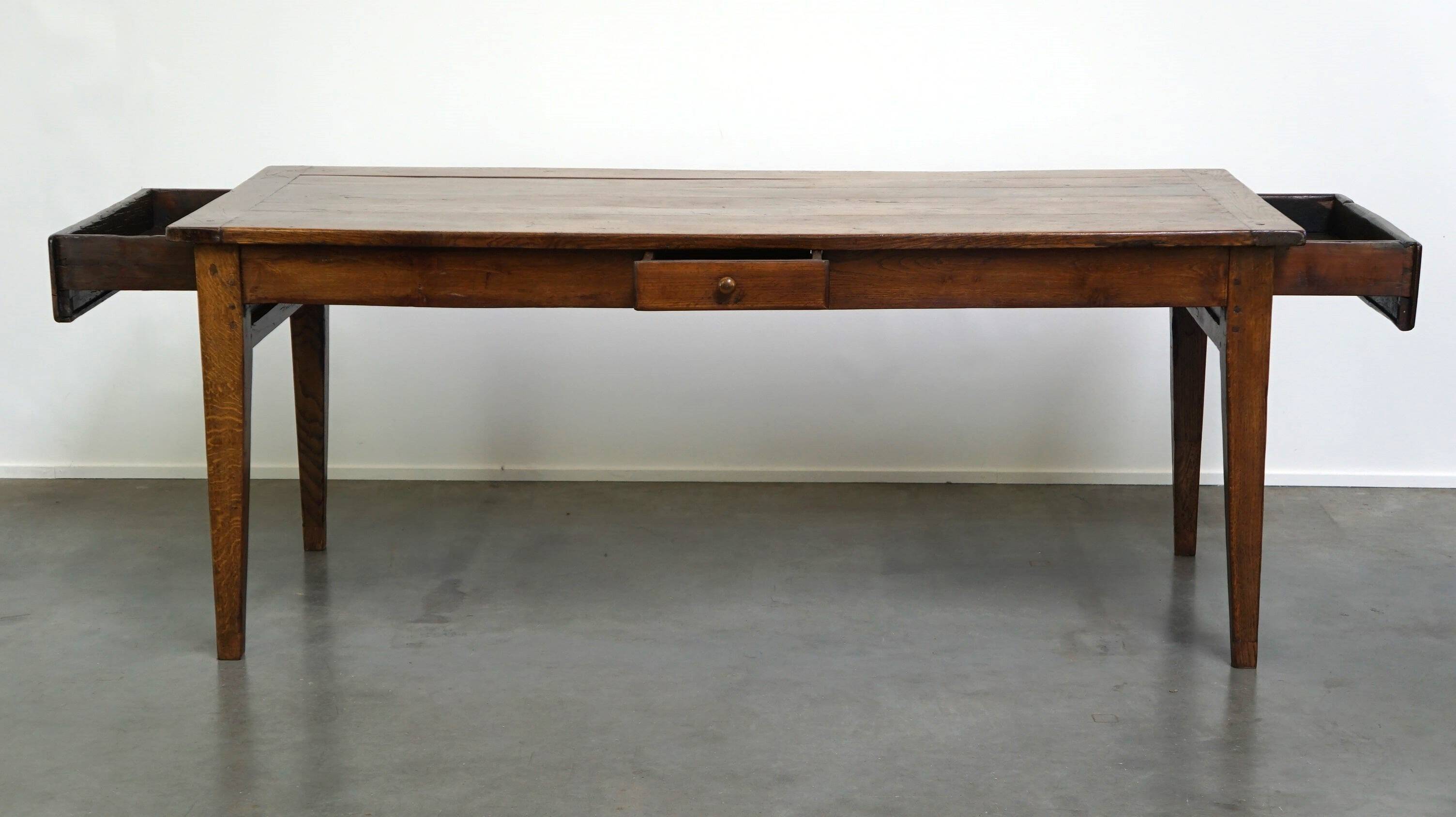 antique French oak dining table with 3 drawers and an exquisite patina